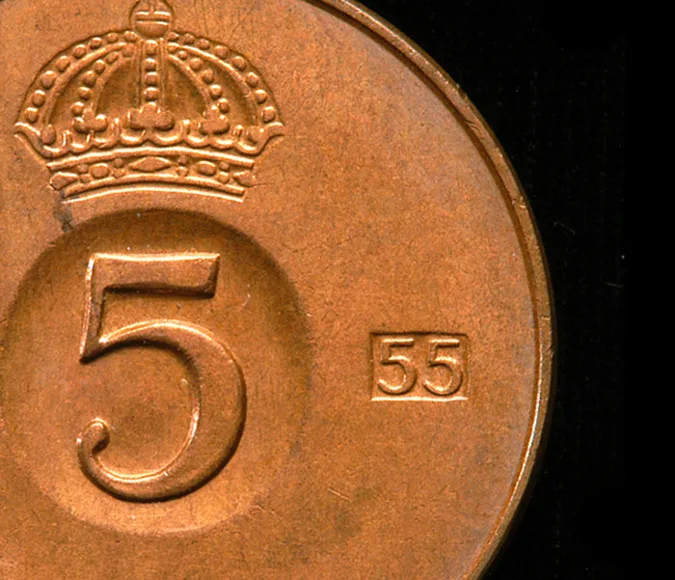 Coin with large number five and a crown