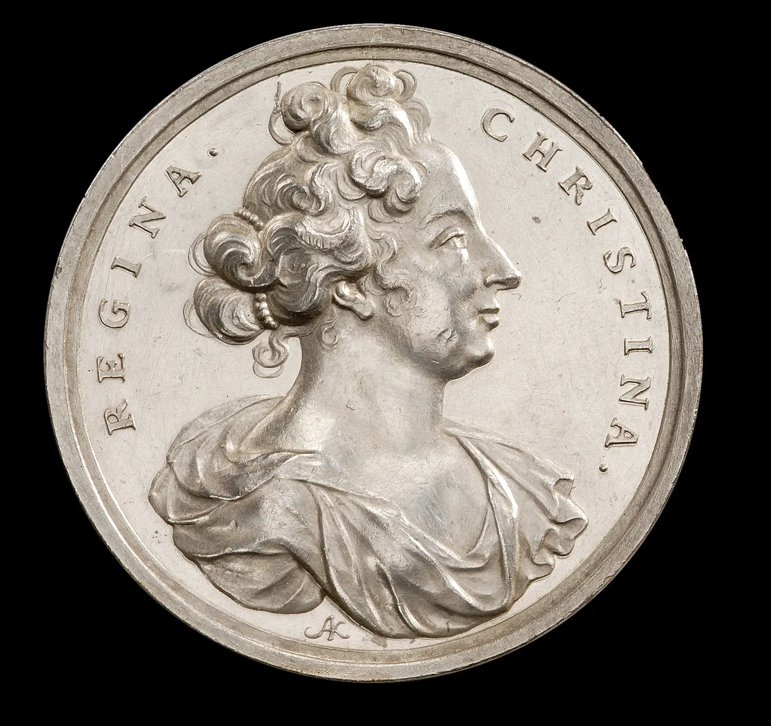 A coin with a portrait of Christina, Queen of Sweden.