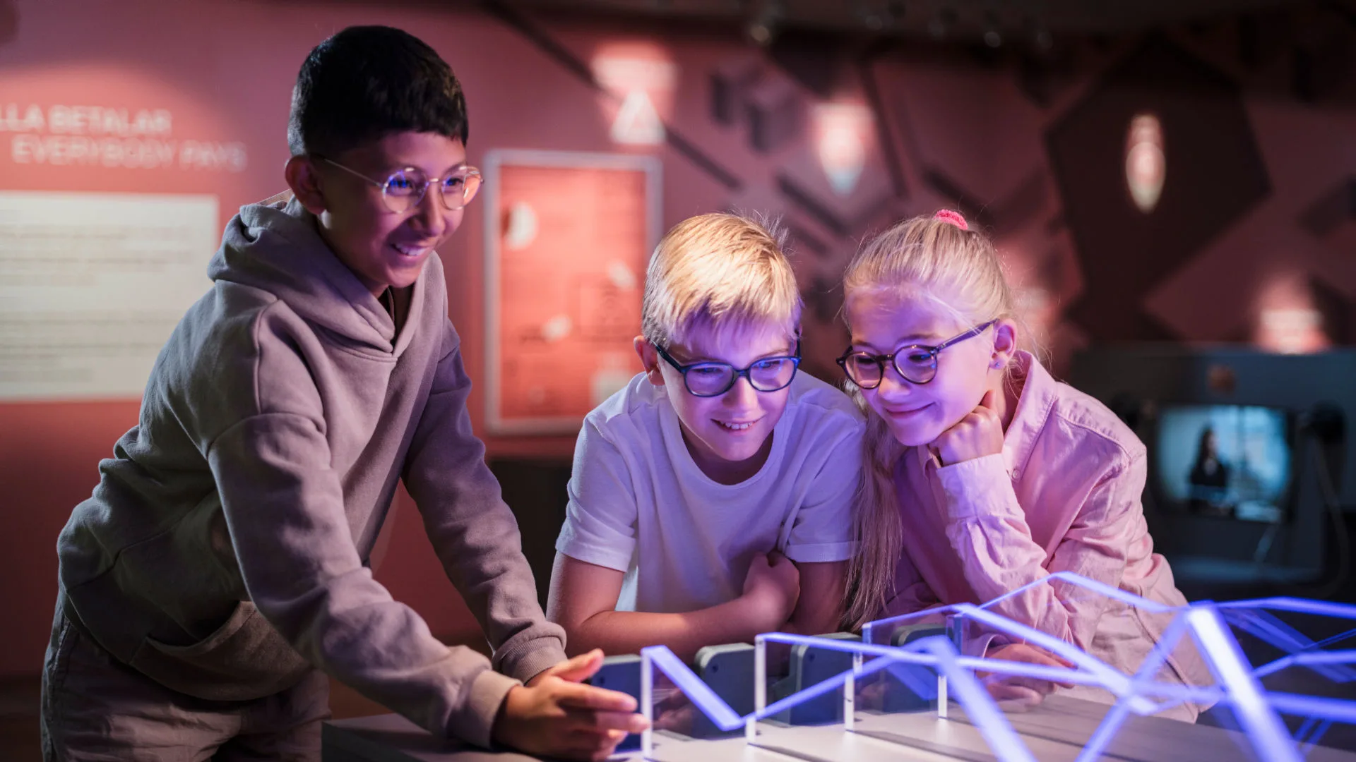 Three young visitors in the museum